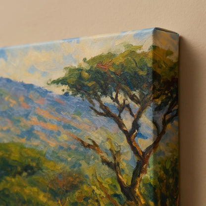 Close-up of the canvas edge showing the 4 cm gallery-wrap profile, the impressionist illustration continuing around the side, acacia tree and blue hills on textured cotton-polyester canvas over a wood frame.