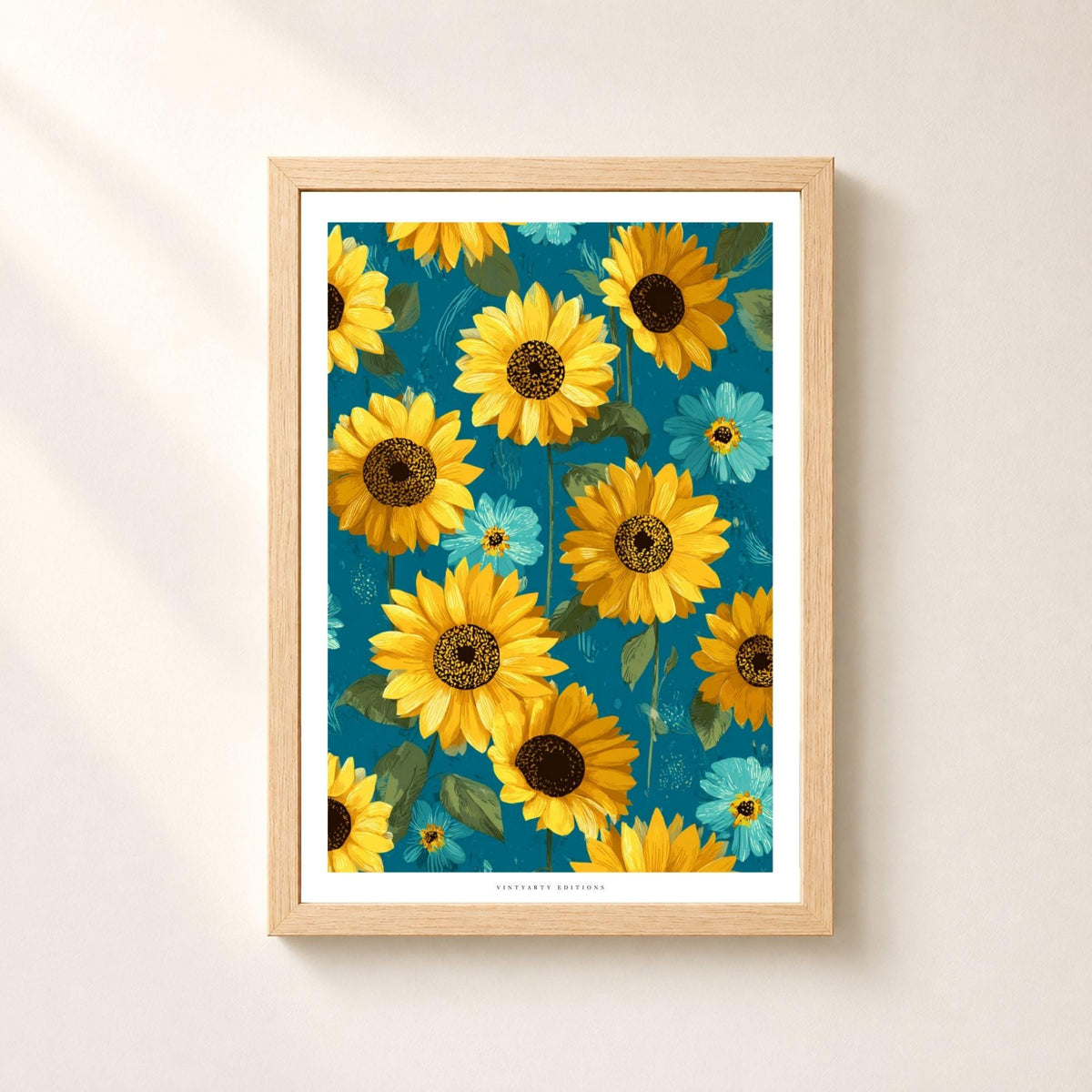 Affiche florale composée de grands tournesols jaunes et orange, de petites fleurs turquoise et de feuillages verts sur fond bleu pétrole, avec marge blanche intégrée.