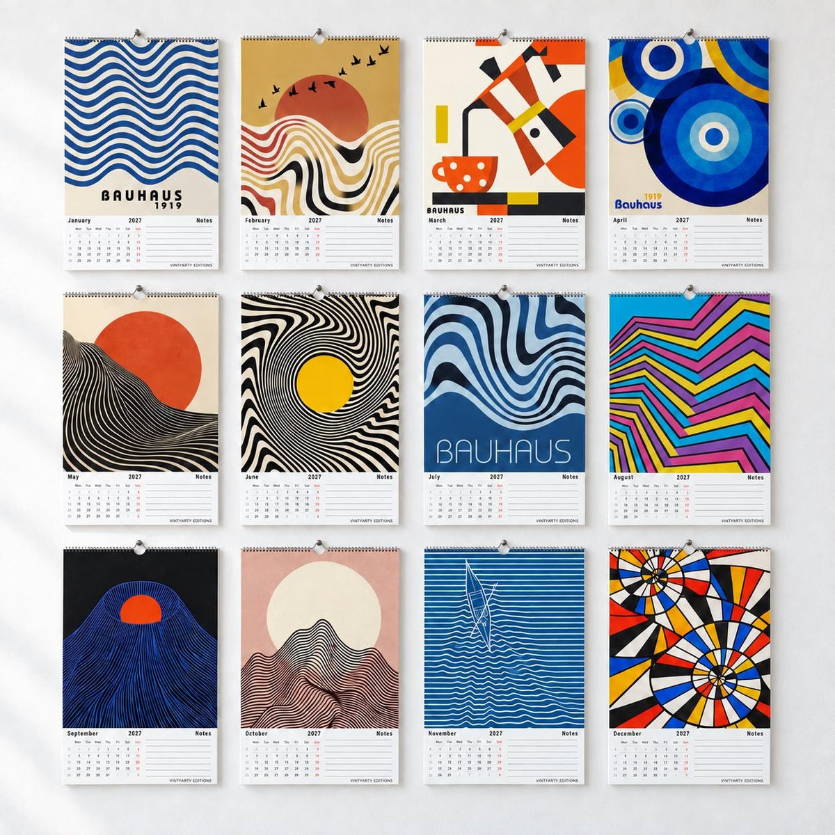 All 12 illustrated pages of the 2027 Bauhaus Op Art wall calendar hung in a grid, January to December